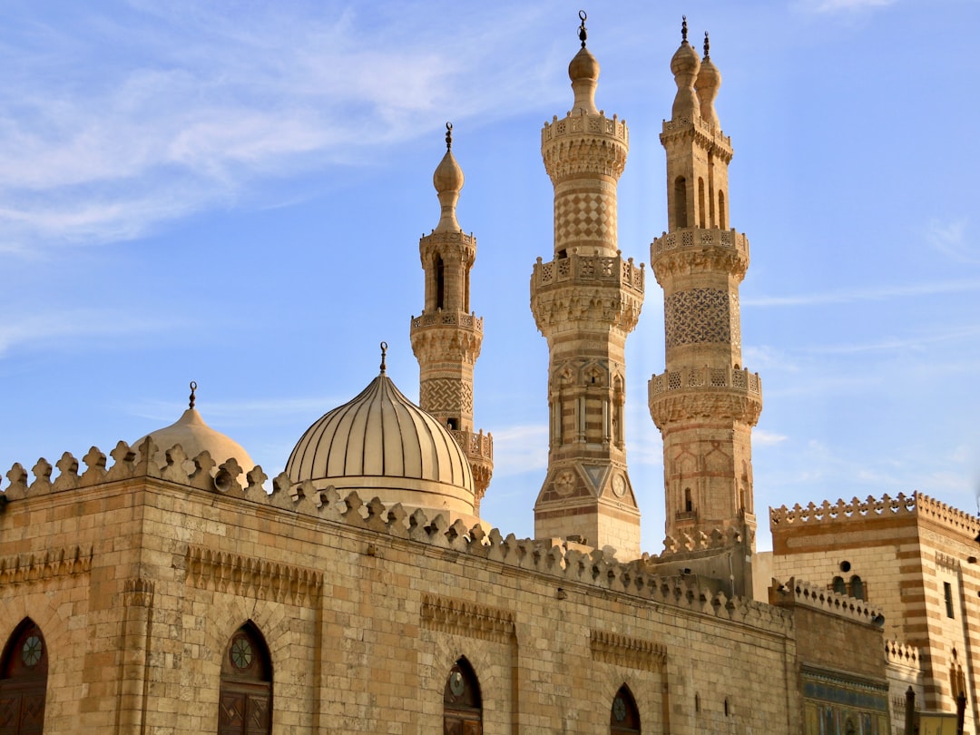 Domes and minarets of Islamic Cairo against blue sky