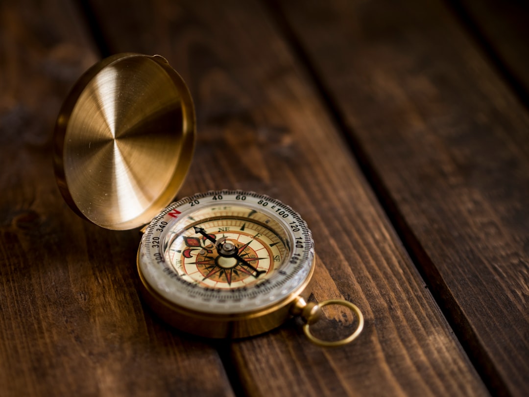 Brass compass on a desk