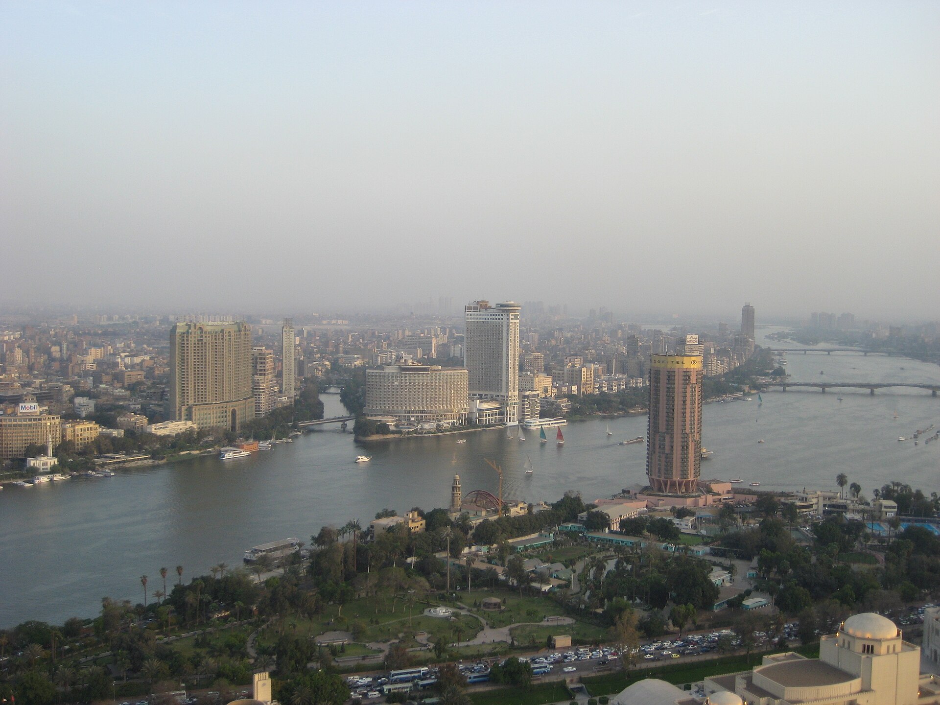 Nile curving through Cairo with feluccas on the water
